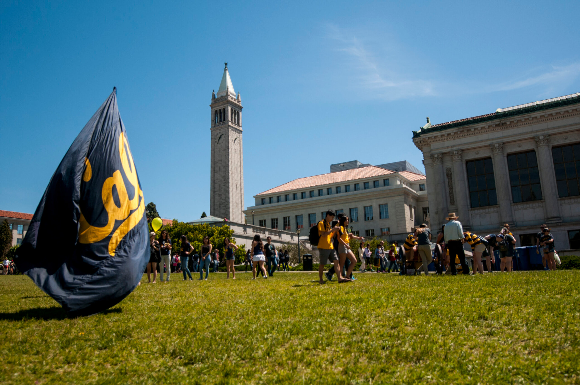 UC Berkeley Campanile overlooking the San Francisco Bay and Golden Gate Bridge at sunset.